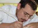 Rabbinical Student Bentzion Shemtov performing the Traditional Scribal Art